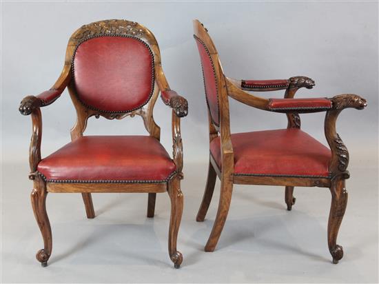 A set of six mid 19th century Anglo Indian carved padouk elbow chairs, W. 2ft. H.3ft 1in.
